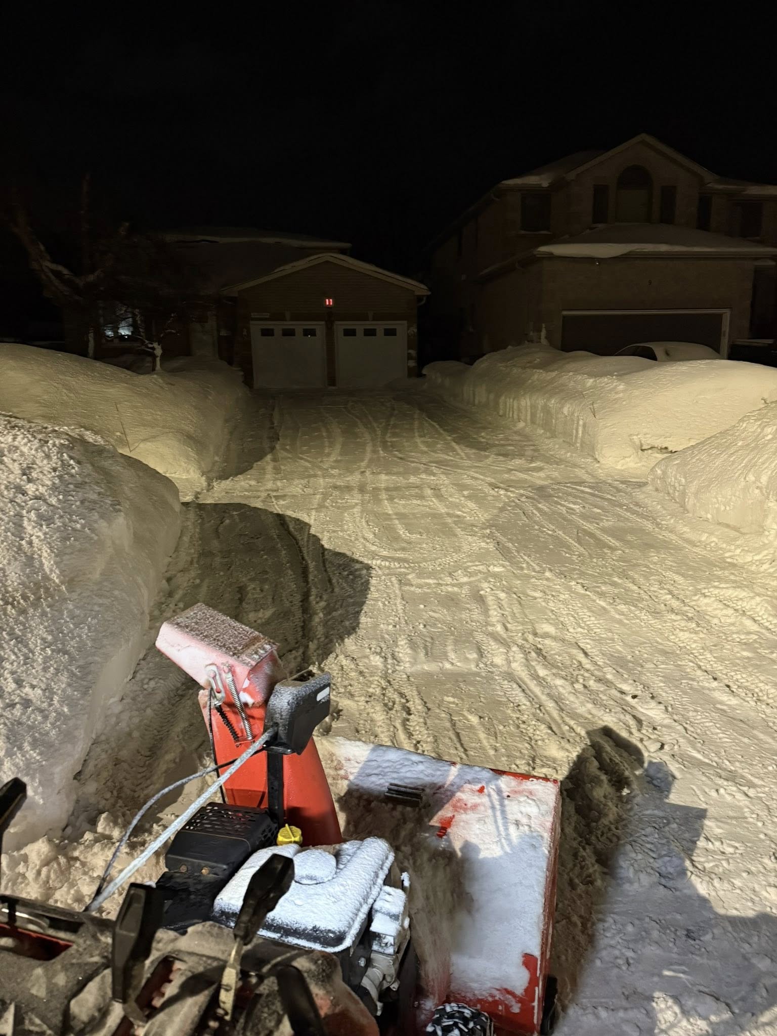 Driveway snowblower clearing deep accumulation in Orillia